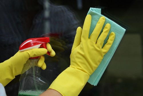 Carpet cleaning technician preparing safe equipment and workspace