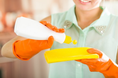 Professional cleaner refreshing a Dulwich Airbnb bedroom